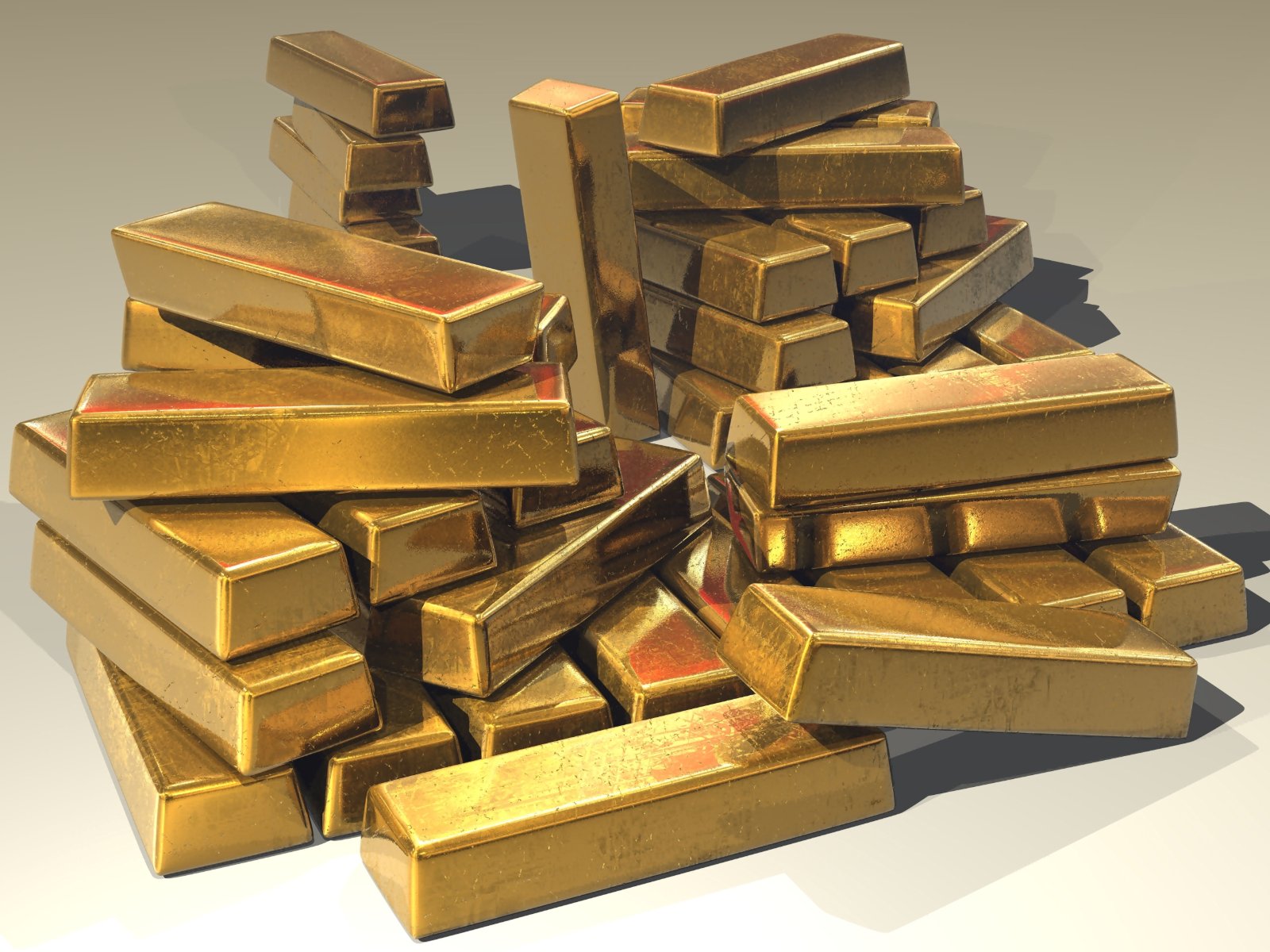 Stacked gold bullion bars, the reserve behind money before the end of the gold standard